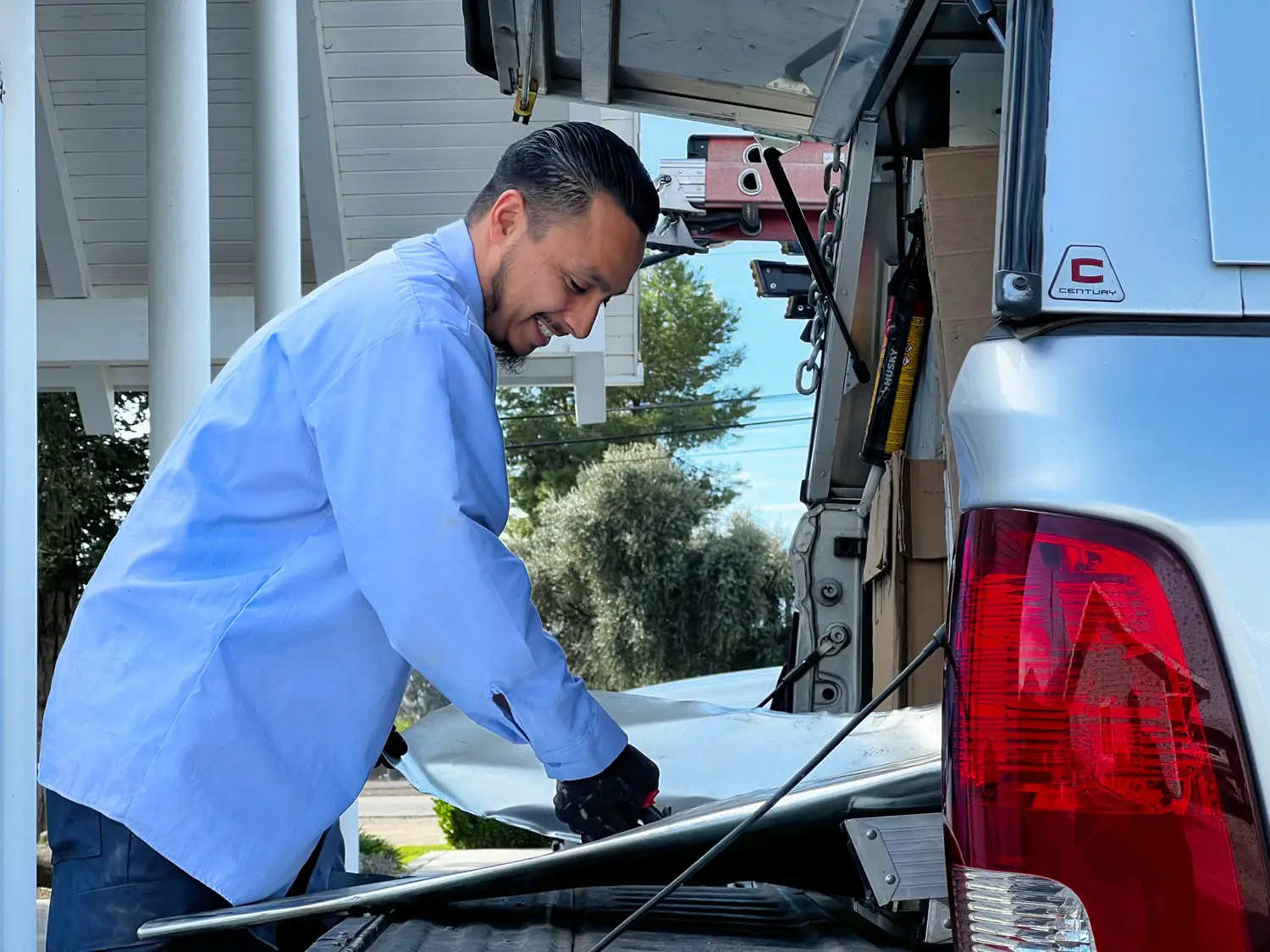 Nalk technician working at the back of a service truck