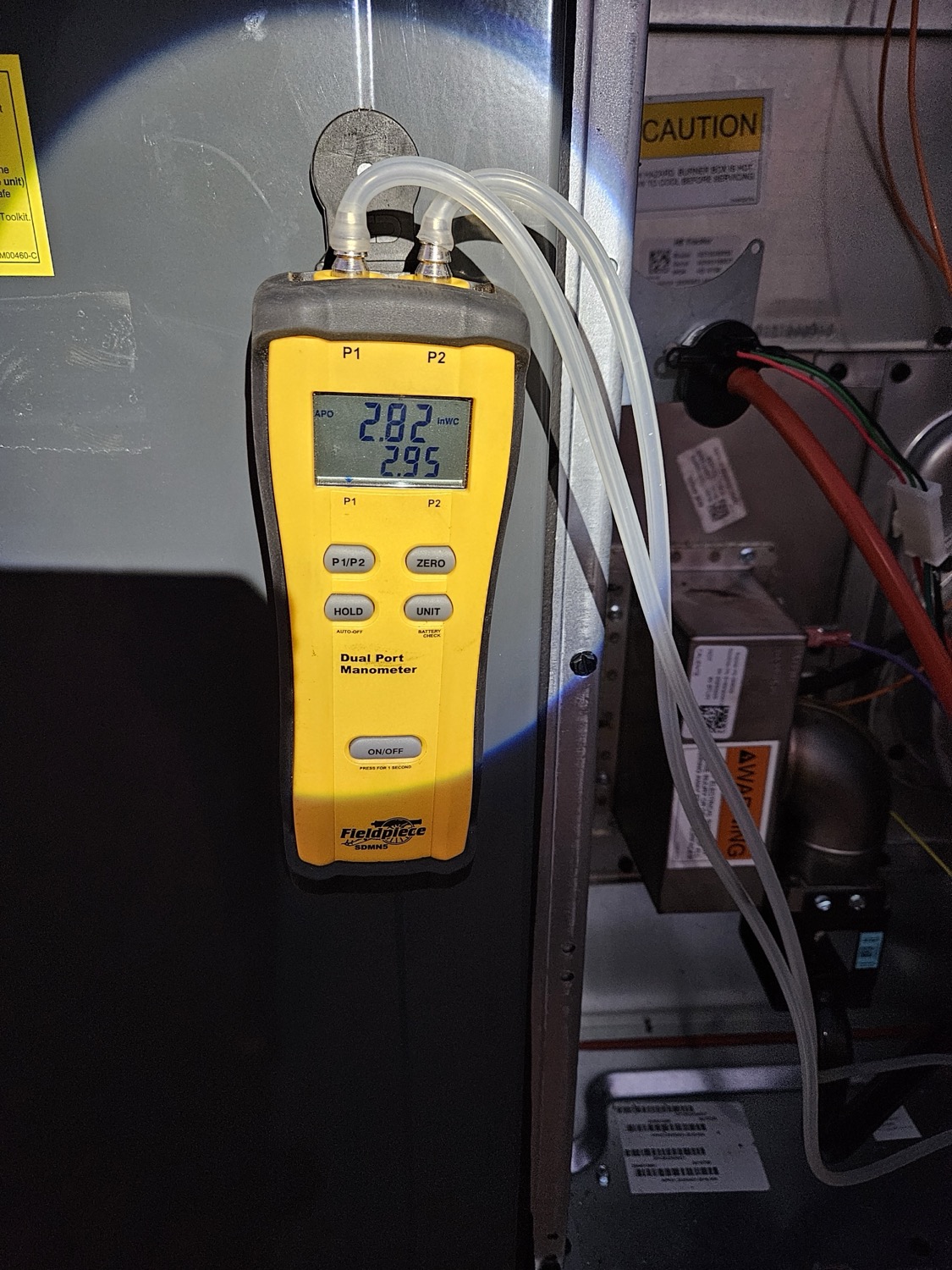 Close-up detail of uneven heating in a Fresno home showing warm light in one area and cool shadows in another.