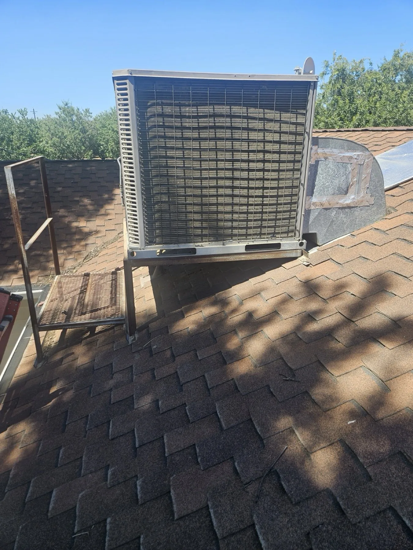 Rooftop evaporative swamp cooler on a home in the Easton area